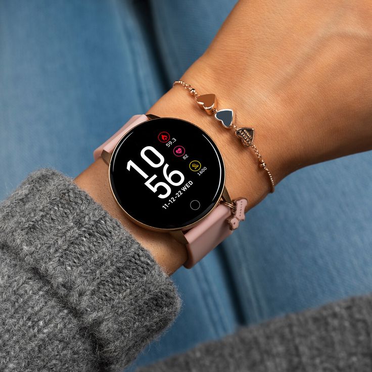 ACTIVE 2 SMART WATCH displaying time on a wrist with a pink strap and silver bracelet.